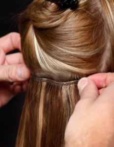 putting on hair clip-ins