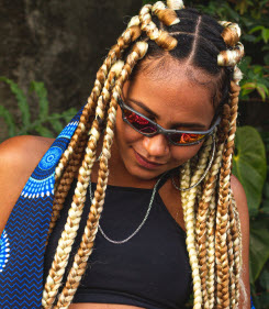 African American woman with with blonde extensions in braids 